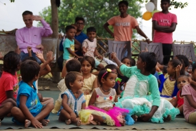 The community celebrates the new educational program that has been introduced to their village, at one of the slums in India where Charity United's educational programs are now in place.