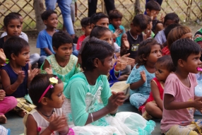 The community celebrates the new educational program that has been introduced to their village, at one of the slums in India where Charity United's educational programs are now in place.