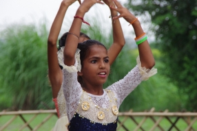 The community celebrates the new educational program that has been introduced to their village, at one of the slums in India where Charity United's educational programs are now in place.