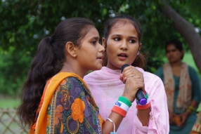 The community celebrates the new educational program that has been introduced to their village, at one of the slums in India where Charity United's educational programs are now in place.