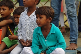 The community celebrates the new educational program that has been introduced to their village, at one of the slums in India where Charity United's educational programs are now in place.