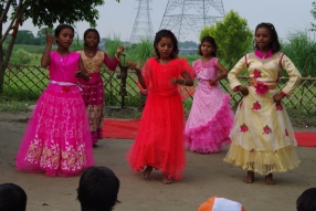 The community celebrates the new educational program that has been introduced to their village, at one of the slums in India where Charity United's educational programs are now in place.