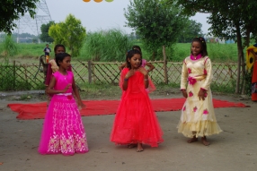 The community celebrates the new educational program that has been introduced to their village, at one of the slums in India where Charity United's educational programs are now in place.