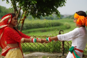 The community celebrates the new educational program that has been introduced to their village, at one of the slums in India where Charity United's educational programs are now in place.