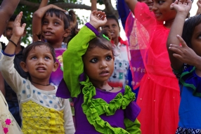 The community celebrates the new educational program that has been introduced to their village, at one of the slums in India where Charity United's educational programs are now in place.