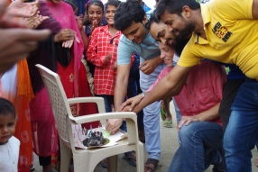 The community celebrates the new educational program that has been introduced to their village, at one of the slums in India where Charity United's educational programs are now in place.