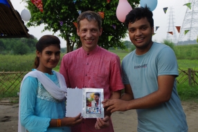 The community celebrates the new educational program that has been introduced to their village, at one of the slums in India where Charity United's educational programs are now in place.