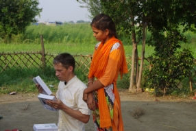 Children study English using the <i>Ollie the Elephant</i> books, at one of the slums in India where Charity United's educational programs are in operation.