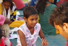 Children study English using the <i>Ollie the Elephant</i> books, at one of the slums in India where Charity United's educational programs are in operation.
