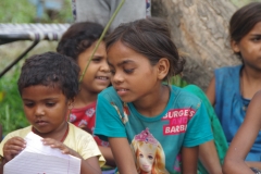 Classes being held at one of the slums in India where Charity United’s educational programs are in operation.