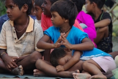 The community celebrates the new educational program that has been introduced to their village, at one of the slums in India where Charity United's educational programs are now in place.