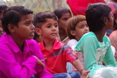 The community celebrates the new educational program that has been introduced to their village, at one of the slums in India where Charity United's educational programs are now in place.