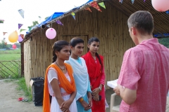 Children study English using the <i>Ollie the Elephant</i> books, at one of the slums in India where Charity United's educational programs are in operation.