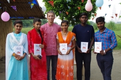 Children study English using the <i>Ollie the Elephant</i> books, at one of the slums in India where Charity United's educational programs are in operation.