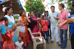 The community celebrates the new educational program that has been introduced to their village, at one of the slums in India where Charity United's educational programs are now in place.