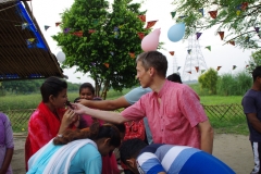 The community celebrates the new educational program that has been introduced to their village, at one of the slums in India where Charity United's educational programs are now in place.