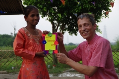 The community celebrates the new educational program that has been introduced to their village, at one of the slums in India where Charity United's educational programs are now in place.