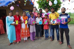 The community celebrates the new educational program that has been introduced to their village, at one of the slums in India where Charity United's educational programs are now in place.