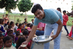 The community celebrates the new educational program that has been introduced to their village, at one of the slums in India where Charity United's educational programs are now in place.