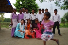 The community celebrates the new educational program that has been introduced to their village, at one of the slums in India where Charity United's educational programs are now in place.