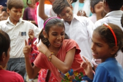 The community celebrates the new educational program that has been introduced to their village, at one of the slums in India where Charity United's educational programs are now in place.