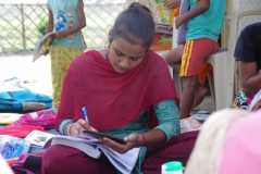 Classes being held at one of the slums in India where Charity United’s educational programs are in operation.