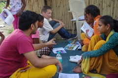 Children study English using the <i>Ollie the Elephant</i> books, at one of the slums in India where Charity United's educational programs are in operation.