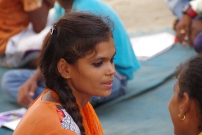 Children study English using the <i>Ollie the Elephant</i> books, at one of the slums in India where Charity United's educational programs are in operation.