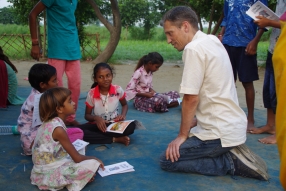 Children study English using the <i>Ollie the Elephant</i> books, at one of the slums in India where Charity United's educational programs are in operation.